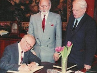 Leonard J. Grant, Vice President, National Geographic Society (with Dr. Boris B. Piotrovksy, Director, State Hermitage Museum and Jeffrey A. Dering, Director, National Geographic Society Museum, Explorers Hall) sign documents leading to first, US-USSR Cultural Business Joint Venture Agreement (Jan 1989) at State Hermitage Museum, St. Petersburg, Russia.